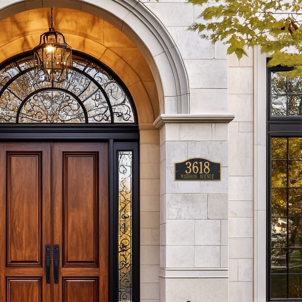 Whitehall house number sign against modern house