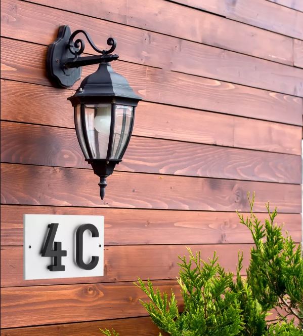 Floating house number sign below a lampshade
